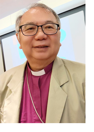 Bishop Patrick Yu wears a red shirt with a priest collar, with tan blazer on top