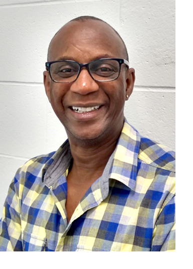 Randolph Williams wears a blue and yellow plaid shirt