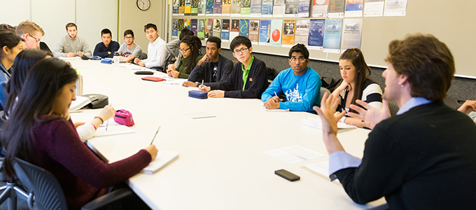 Prof. Michael Kessler with Trinity One students in a seminar classroom