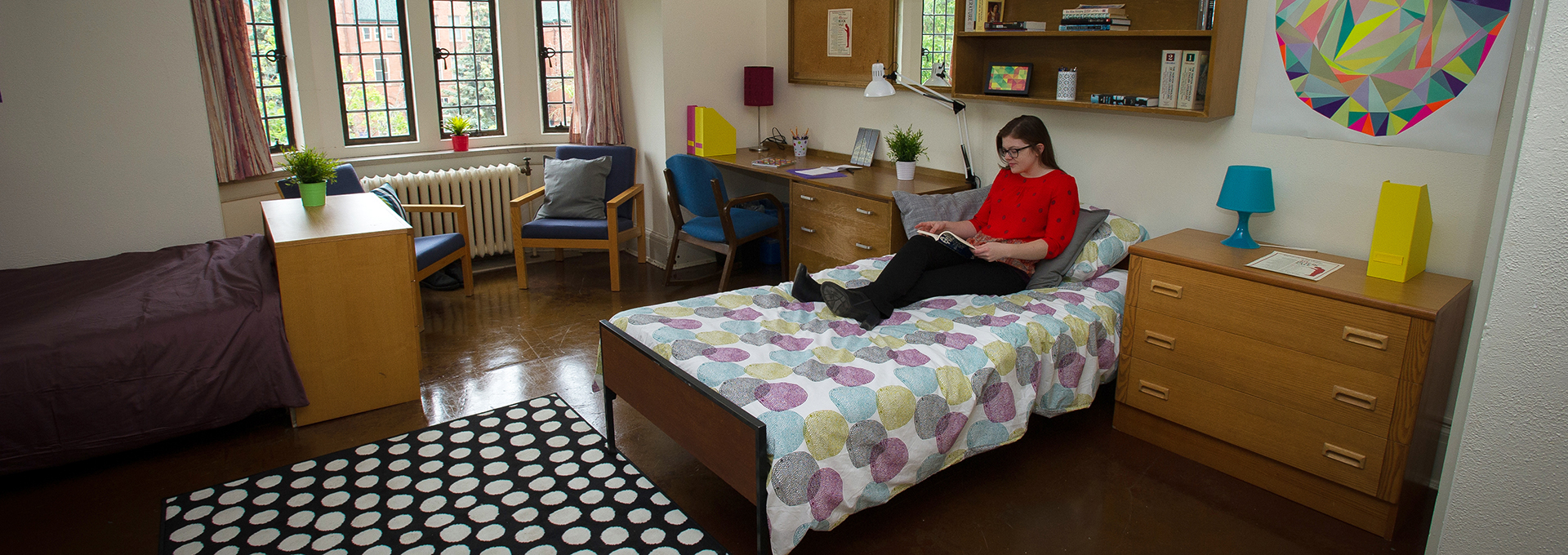 Student reading in her residence room