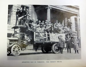 Students from the College celebrate the Armistice on November 11, 1918 in the Trinity Truck