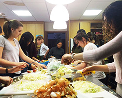Student volunteers preparing food for the Community Cooking initiative